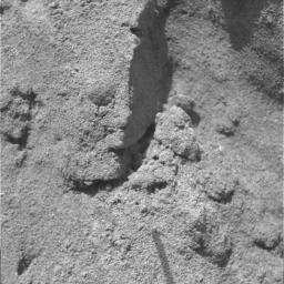 NASA's Opportunity rover shows soil clods exposed in the upper wall of the trench dug by its right front wheel. The presence of soil clods implies weak bonding between individual soil grains.