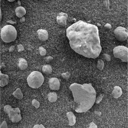 This image taken by NASA's Mars Exploration Rover Opportunity's instrument deployment device or 'arm', shows the crater floor at Meridiani Planum, Mars. Grains of soil on the floor appear sand-sized with millimeter-sized pebbles on top.