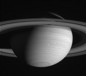 This image of Saturn captured by NASA's Cassini spacecraft shows white feathery clouds near 45 degrees south latitude.