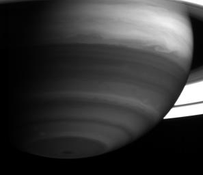 Saturn's bright equatorial band displays an exquisite swirl near the planet's eastern limb. This image was captured by NASA's Cassini spacecraft on May 18, 2004, from a distance of 23.4 million kilometers (14.5 million miles) from Saturn.