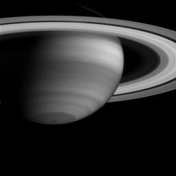 In this image, dark regions represent areas where NASA's Cassini spacecraft is seeing into deeper levels in Saturn's atmosphere.