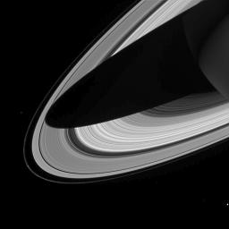 This image captured by NASA's Cassini spacecraft shows a dramatic view of Saturn's rings draped by the shadow of Saturn.