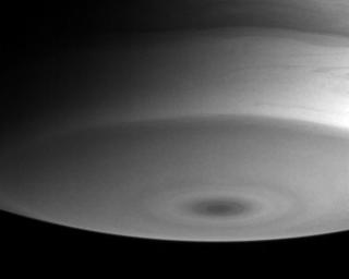 Saturn's southern polar region exhibits concentric rings of clouds which encircle a dark spot at the pole, as shown in this image from NASA's Cassini spacecraft.