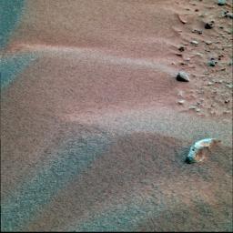 NASA's Mars Exploration Rover Spirit's shows peak-like formations on the martian terrain at Gusev Crater. Seen are particles made of dust, sand and coarse sand, with their sizes approximating flour, sugar, and ball bearings, respectively.