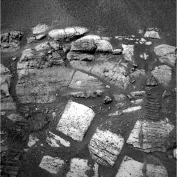 NASA's Mars Exploration Rover Opportunity shows the layered rocks of the 'El Capitan' area near the rover's landing site at Meridani Planum, Mars. Visible on two of the rocks are the holes drilled by the rover.