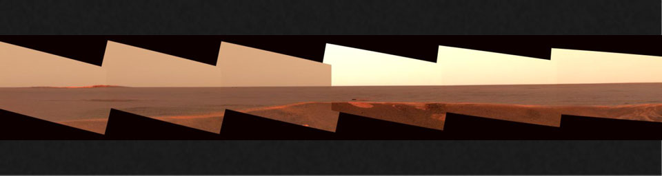 This image mosaic from the panoramic camera on NASA's Mars Exploration Rover Opportunity shows the distant horizon from Opportunity's position inside a small crater at Meridiani Planum, Mars.