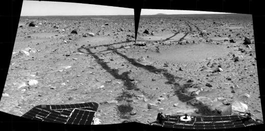 This pair of pieced-together images was taken by the Mars Exploration Rover, Spirit, looking aft on March 6, 2004. It reveals the long and rocky path of nearly 787 feet that Spirit had traveled since safely arriving at Gusev Crater on Jan. 3, 2004.