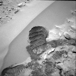 NASA's Mars Exploration Rover Spirit acquired this imageMarch 15, 2004, after digging its wheel into the drift dubbed 'Serpent' creating the scar that allowed the rover's instruments to see below the drift surface.
