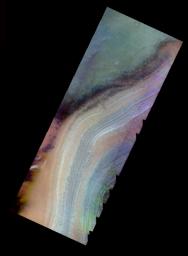This false-color image from NASA's 2001 Mars Odyssey released on March 13, 2004 shows Mars' polar cap during the southern spring season; both the layered ice cap and darker 'spots' that are seen only when the sun first lights the polar surface. 