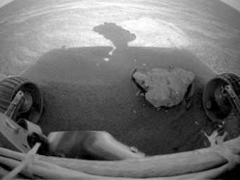 This image from NASA's Mars Exploration Rover Opportunity front left hazard-avoidance camera shows a pebble caught in rover's front right wheel. 