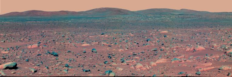 This false-color mosaic image from NASA's Mars Exploration Rover Spirit panoramic camera shows the view acquired on April 3, 2004. Colors have been exaggerated to enhance the differences between cleaner and dustier rocks, and lighter and darker soils.