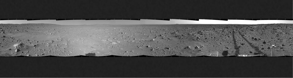 This cylindrical-projection mosaic was created by NASA's Mars Exploration Rover Spirit acquired on sol 93 (April 7, 2004). It reveals the martian view from Spirit's position during the four-sol flight software update that began on sol 94.