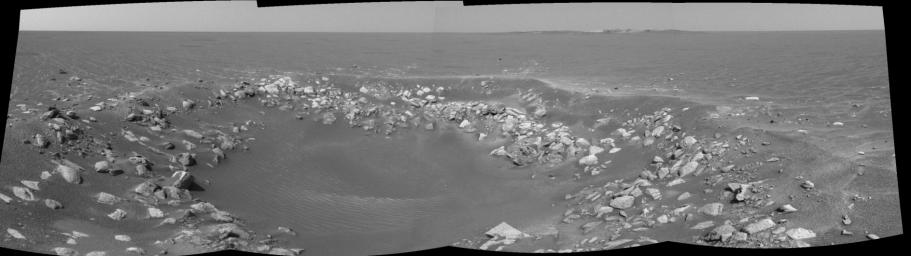 This cylindrical projection was taken by the navigation camera onboard NASA's Mars Exploration Rover Opportunity. The view is a region dubbed 'Fram Crater' located .3 miles from 'Eagle Crater' and roughly 820 feet from 'Endurance Crater' (upper right).