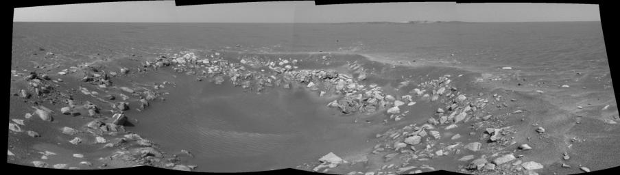 This cylindrical projection was taken by the navigation camera onboard NASA's Mars Exploration Rover Opportunity. The view is a region dubbed 'Fram Crater' located .3 miles from 'Eagle Crater' and roughly 820 feet from 'Endurance Crater' (upper right).
