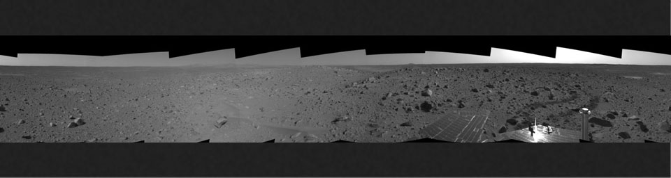 This cylindrical-projection mosaic was assembled from images taken by the navigation camera on the Mars Exploration Rover Spirit on sol 107 (April 21, 2004) at a region dubbed 'site 32.' Spirit is sitting east of 'Missoula Crater' on the outer plains.