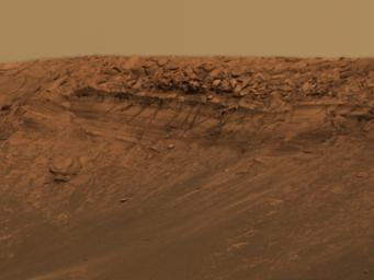 This approximate true-color image taken by the panoramic camera NASA's Mars Exploration Rover Opportunity highlights the vertical drop on a feature called 'Burns Cliff' within the impact crater known as 'Endurance.' 