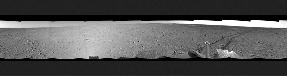 This left-eye mosaic was created from images that NASA's Mars Exploration Rover Spirit acquired May 6, 2004. Continuing its trek toward the 'Columbia Hills,' Spirit broke its record for the longest distance traveled in one Martian day.