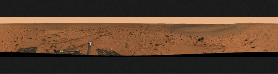 This 360-degree view is from NASA's Mars Exploration Rover Spirit beside the crater informally named 'Bonneville.' The entire mosaic reveals not only the crater rim and interior, but Spirit's tracks and a glimpse at part of the rover. 