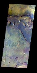 This false-color image released on May 18, 2004 from NASA's 2001 Mars Odyssey of Tinjar Vallis on Mars was acquired Oct. 20, 2002, during northern spring.