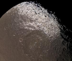 This image captured by NASA's Cassini spacecraft reveals the colorful and intriguing surface of Saturn's moon Iapetus in unrivaled clarity.