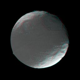 This stereo view of Iapetus was created by combining two NASA Cassini images, which were taken one day apart. The view serves mainly to show the spherical shape of Iapetus and some of the moon's topography. 3D glasses are necessary to view this image.