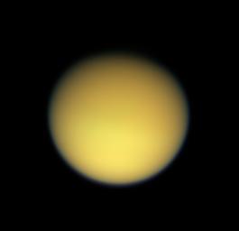Saturn's large, smog-enshrouded moon Titan greets NASA's Cassini spacecraft in full color as the spacecraft makes its third close pass on Feb. 15, 2005.
