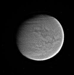 Titan's surface and atmospheric features are shown here in this processed, visible-light image taken by NASA's Cassini spacecraft.