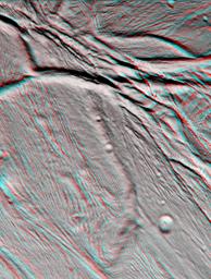 NASA's Cassini spacecraft took images of the ropy, taffy-like topography of Saturn's moon Enceladus from many different angles as the spacecraft flew by on Feb. 17, 2005. 3D glasses are necessary to view this image.