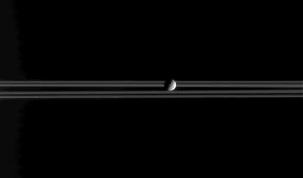 Mimas, a little moon of Saturn with a big crater, is the star of this image, a frame from a movie consisting of 37 individual frames taken over 20 minutes, while NASA's Cassini spacecraft remained sharply pointed at the icy worldlet.