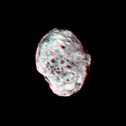 Saturn's moon Hyperion pops into view in this stereo anaglyph created from NASA's Cassini images; differing views are helpful in interpreting the moon's irregular shape. 3D glasses are necessary to view this image.