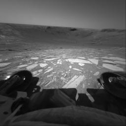 Perched on the edge of 'Endurance Crater,' NASA's Mars Exploration Rover Opportunity prepared to roll all six wheels in and then back out to the rim. This image was taken on June 8, 2004.