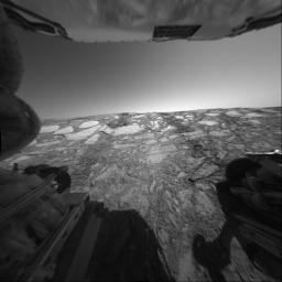 This view from NASA's Mars Exploration Rover Opportunity's rear hazard-avoidance camera looks back up toward the 'Endurance Crater' rim from the deepest point of a dip into the crater on June 9, 2004.