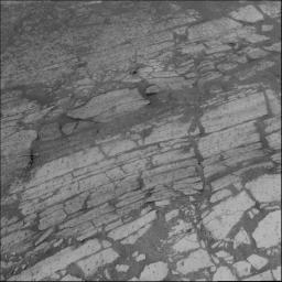 This image taken by the navigation camera on NASA's Mars Exploration Rover Opportunity shows the layers of bedrock that line the walls of 'Endurance Crater' on Mars.