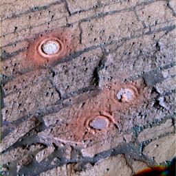 This image taken by NASA's Mars Exploration Rover Opportunity shows the slope of 'Endurance Crater' where the rover cut three holes.