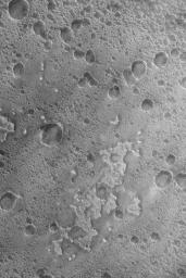 NASA's Mars Global Surveyor shows small buttes and irregular mesas on the floor of a crater in the Nili Fossae region of Mars.