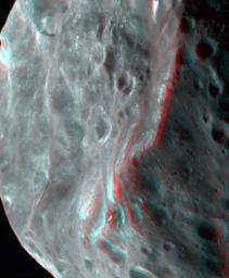 Phoebe's violent, cratered past is evident in this 3D image of the tiny moon captured by NASA's Cassini spacecraft. 3D glasses are necessary to view this image.