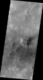 This image released on July 8, 2004 from NASA's 2001 Mars Odyssey shows dust carried aloft by the wind has settled out on every available surface creating sand dunes on Mars.