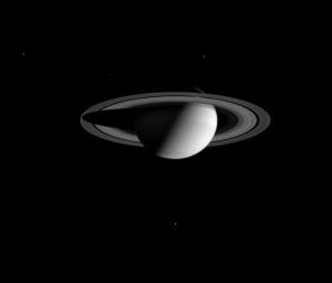 A stately Saturn poses for a portrait with five of its moons, as shown in this image captured by NASA's Cassini spacecraft.