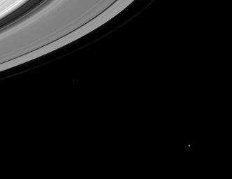 This image captures several important targets of NASA's Cassini mission: icy moons, rings, and the gaps in the rings that may contain small undiscovered moons.