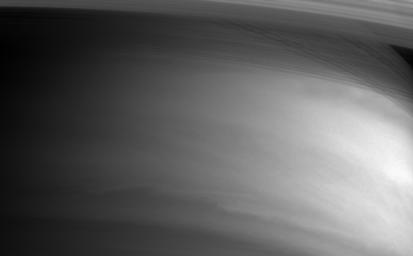 The inner edges of Saturn's rings arc gracefully across the top of this image from NASA's Cassini spacecraft.
