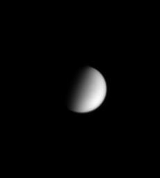 Smog-enshrouded Titan shows itself to be a featureless orb, as captured in this image from NASA's Cassini spacecraft.
