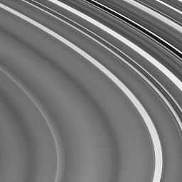 This view of Saturn's outer C ring captured by NASA's Cassini spacecraft shows the extreme variations in brightness, along with the subtle, large-scale wavy variations discovered 24 years ago by NASA's Voyager spacecraft.