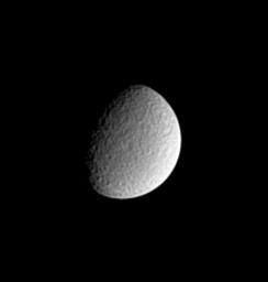 Impact-battered Rhea exhibits a mottled appearance in this image from NASA's Cassini spacecraft.