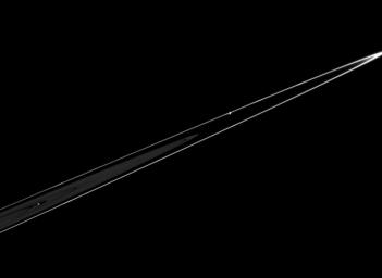 Pandora is seen in this dramatic view, orbiting just beyond the outer edge of Saturn's F ring. This image was taken in visible light with NASA's Cassini spacecraft's narrow-angle camera on Feb. 18, 2005.