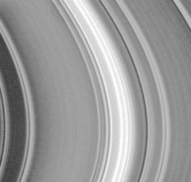 This image of the lit face of Saturn's outer, or A ring was taken by NASA's Cassini spacecraft shortly after crossing the ring plane after its orbit insertion burn.