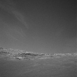 This image taken by NASA's Mars Exploration Rover Opportunity shows winter clouds drifting across the skies at 'Endurance Crater' in Mars' Meridiani Planum.