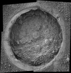 This image taken by NASA's Mars Exploration Rover Opportunity shows a target dubbed 'Campbell' on a rock called 'MacKenzie' in 'Endurance Crater.' Opportunity dug a hole into the target with its rock abrasion tool.