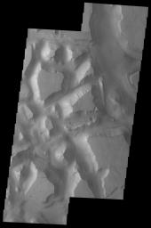 This image released on August 18, 2004 from NASA's 2001 Mars Odyssey shows Hydraotes Chaos. Chaos is a distinctive area of broken terrain.