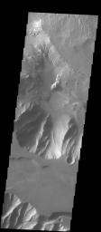 This image released on Sept 21, 2004 from NASA's 2001 Mars Odyssey shows the bordering areas between Ophir Chasma and Candor Chasma on Mars. Wind etched surfaces, and dunes are present on the floor of Ophir Chasma.