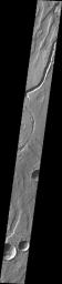 This image released on Oct 12, 2004 from NASA's 2001 Mars Odyssey shows Tyrrhena Patera and its surroundings. Tyrrhena Patera is one of several moderate sized volcanoes located in the Martian southern highlands. 